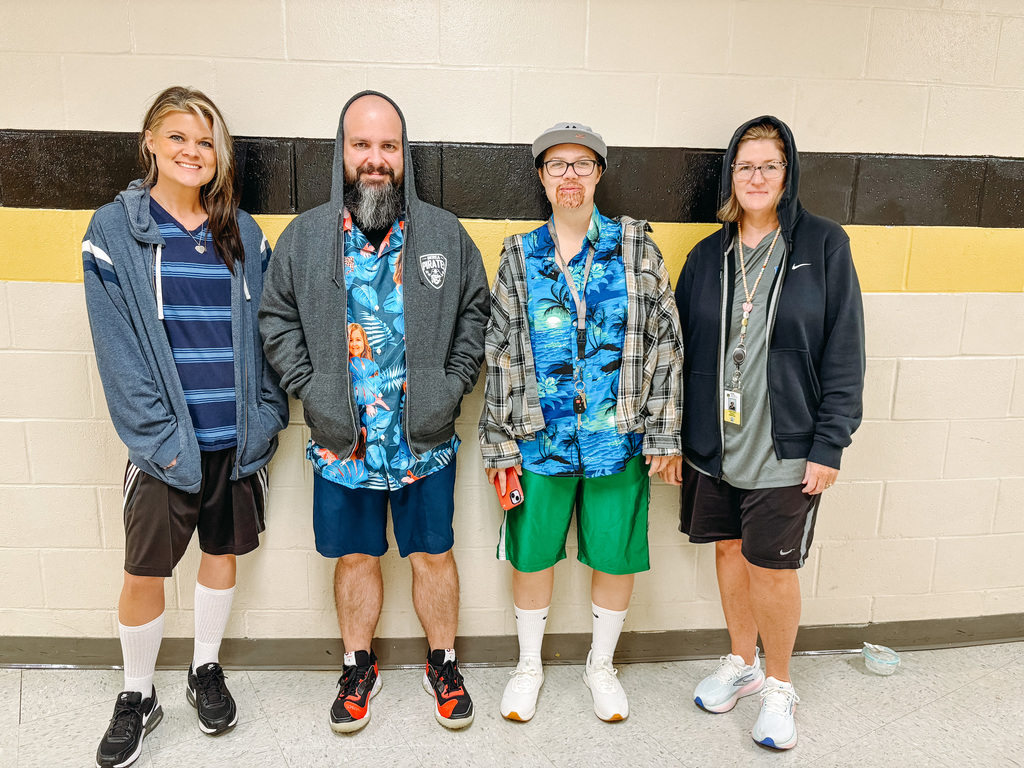 Teachers pose for photo dressed as Adam Sandler