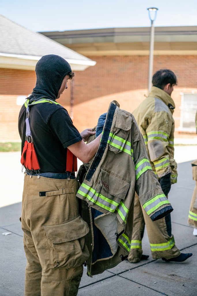 Student suits up in firefighter gear