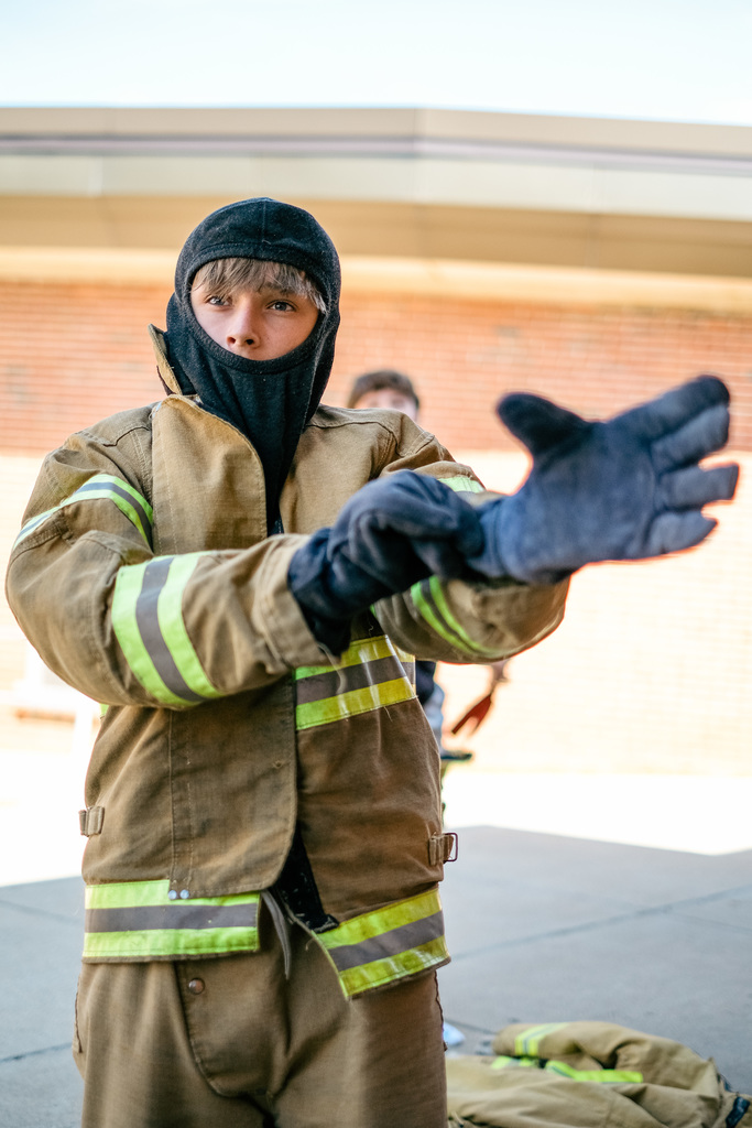 Student suits up in firefighter gear