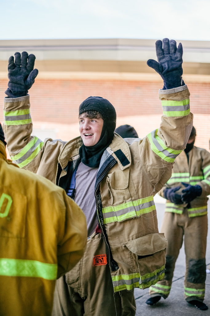 Student suits up in firefighter gear