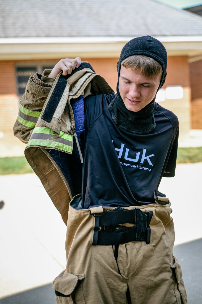 Student suits up in firefighter gear