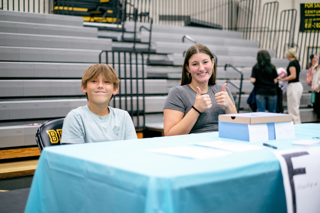 Students sign up for clubs at information booths