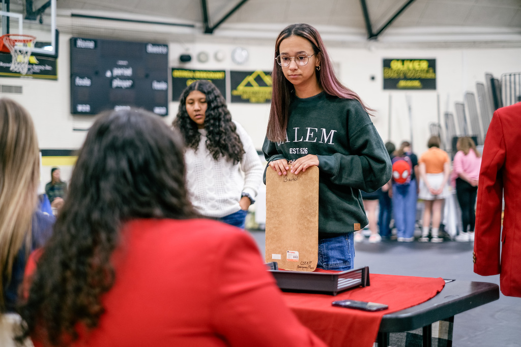 Students sign up for clubs at information booths