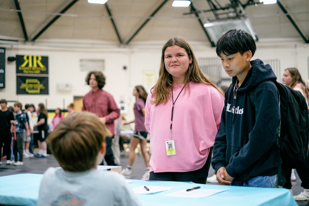 Students sign up for clubs at information booths