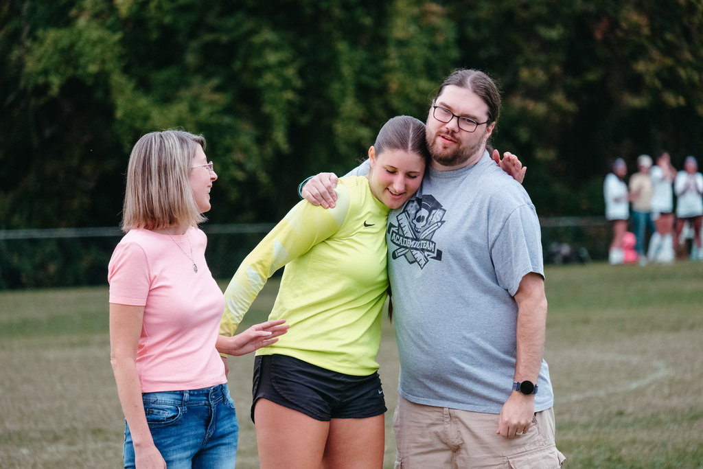 HS Girls Soccer Senior Hugging Teacher