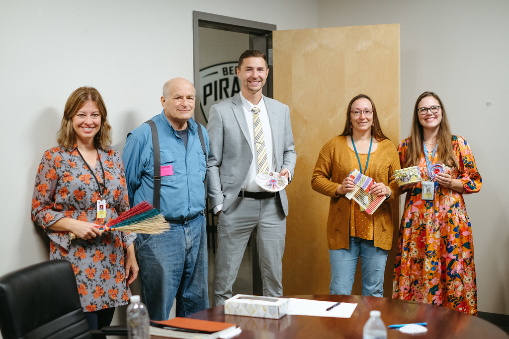 School Admins posing with Berea College Director of Craft Outreach