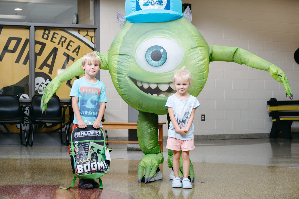 Mrs. Reynolds & Mr. Dollins take on alter-egos to wish students off home on high attendance day