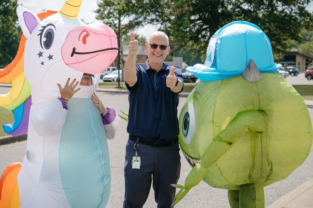 Mrs. Reynolds & Mr. Dollins take on alter-egos to wish students off home on high attendance day