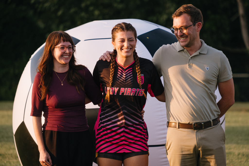 Student Athletes Pose for Photos with their Families During HS Girls Soccer Senior Night