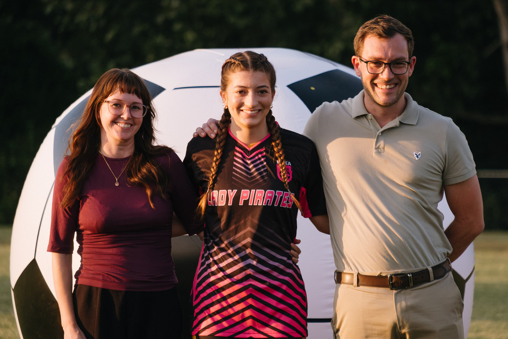 Student Athletes Pose for Photos with their Families During HS Girls Soccer Senior Night