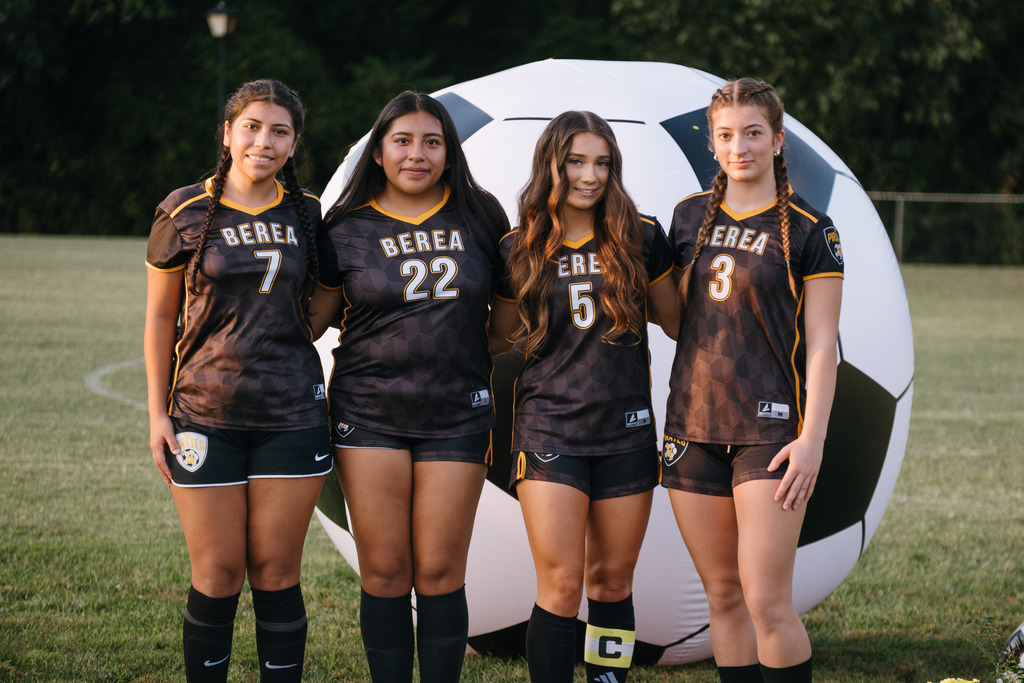 Student Athletes Pose for Photos with their Families During HS Girls Soccer Senior Night