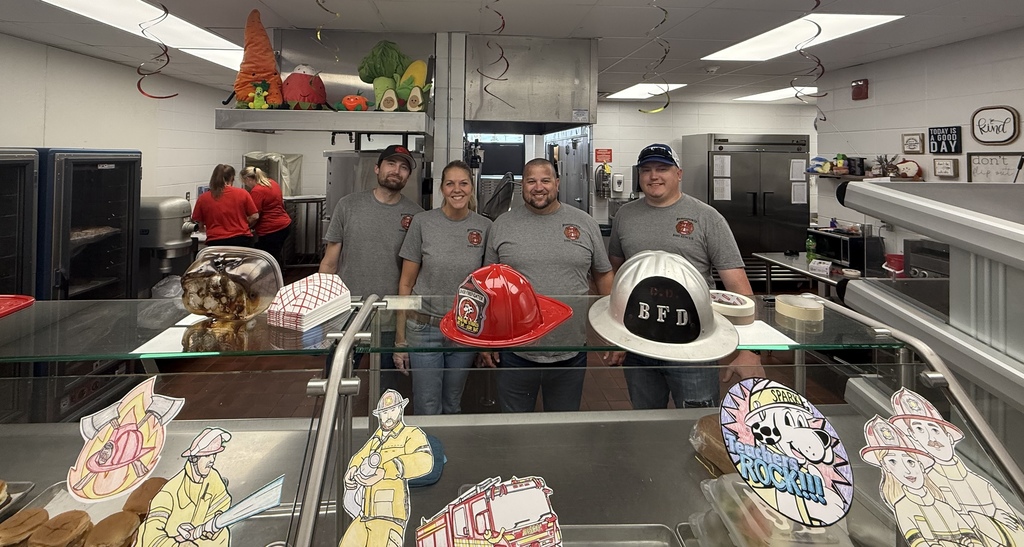 Four volunteer firefighters helping in the middle school and high school lunch lines! Left to right: Dylan Andal, Angela Carlson, Larry Boden, and Colton Laubach.