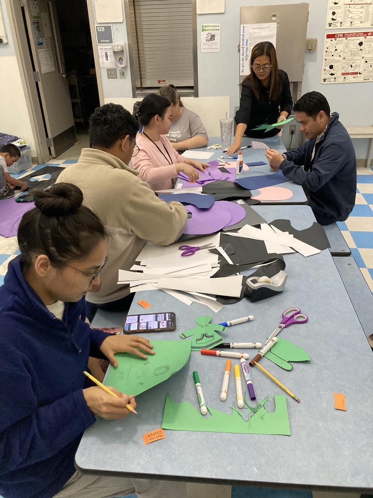 Staff and families making beautiful artwork