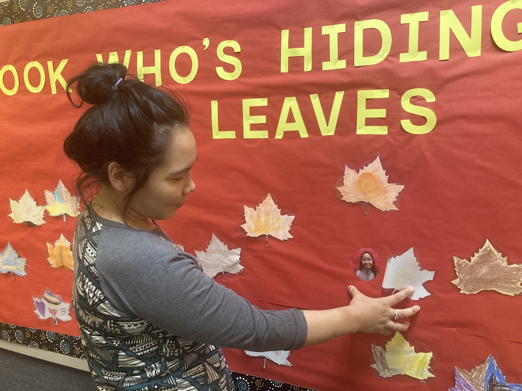 Adorable artists under the leaves