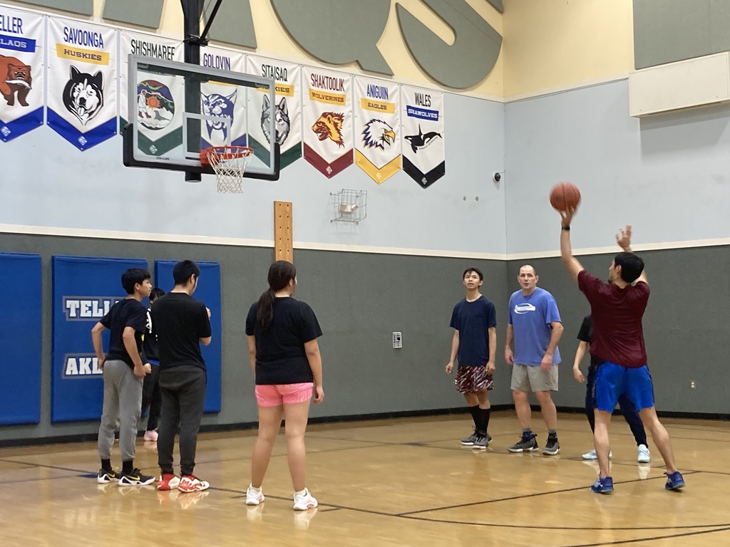 Foul having fun playing student vs staff basketball game