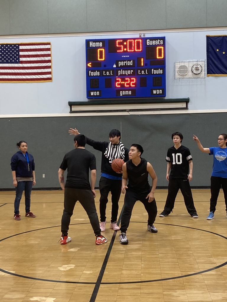 having fun playing student vs staff basketball game Jump ball!