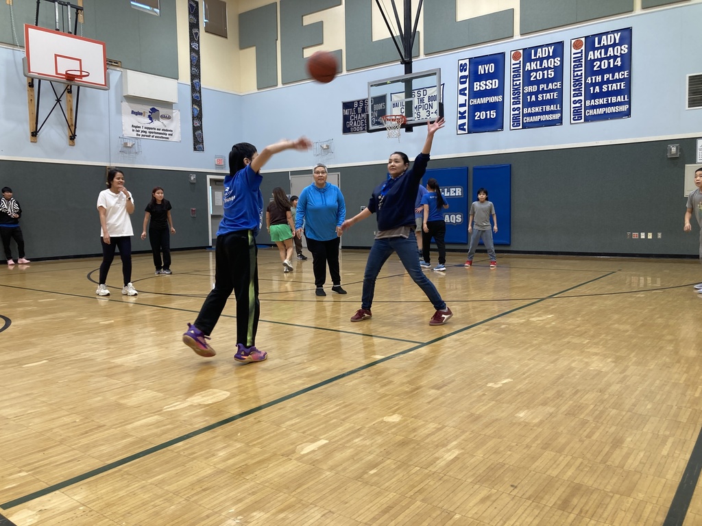 having fun playing student vs staff basketball game