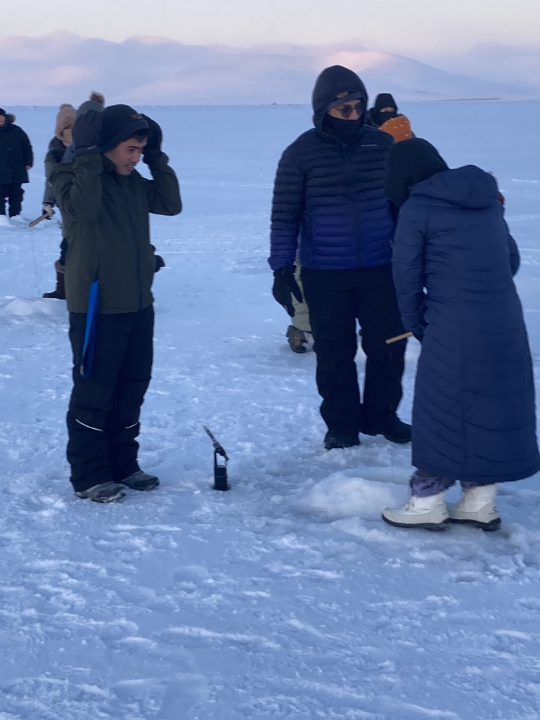 Teachers ice fishing at the derby teller alaska