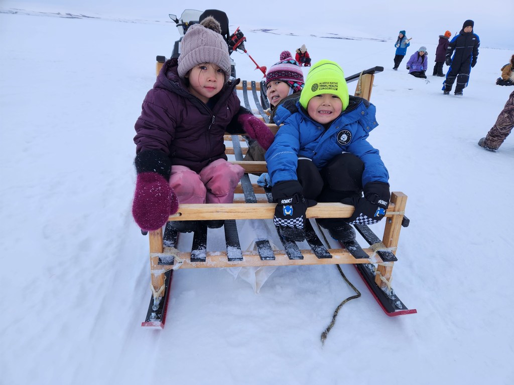 Bexley Robbie and Lilah in the sled after fishing Teller alaska