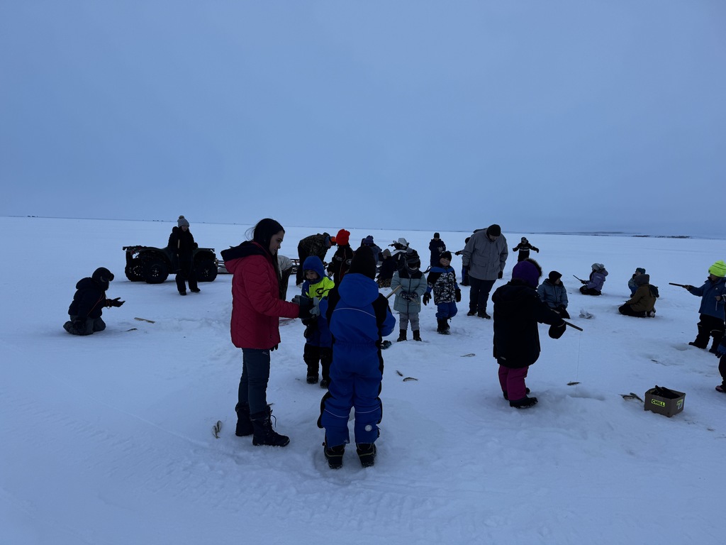 Edlene and Chase ice fishing Teller alaska