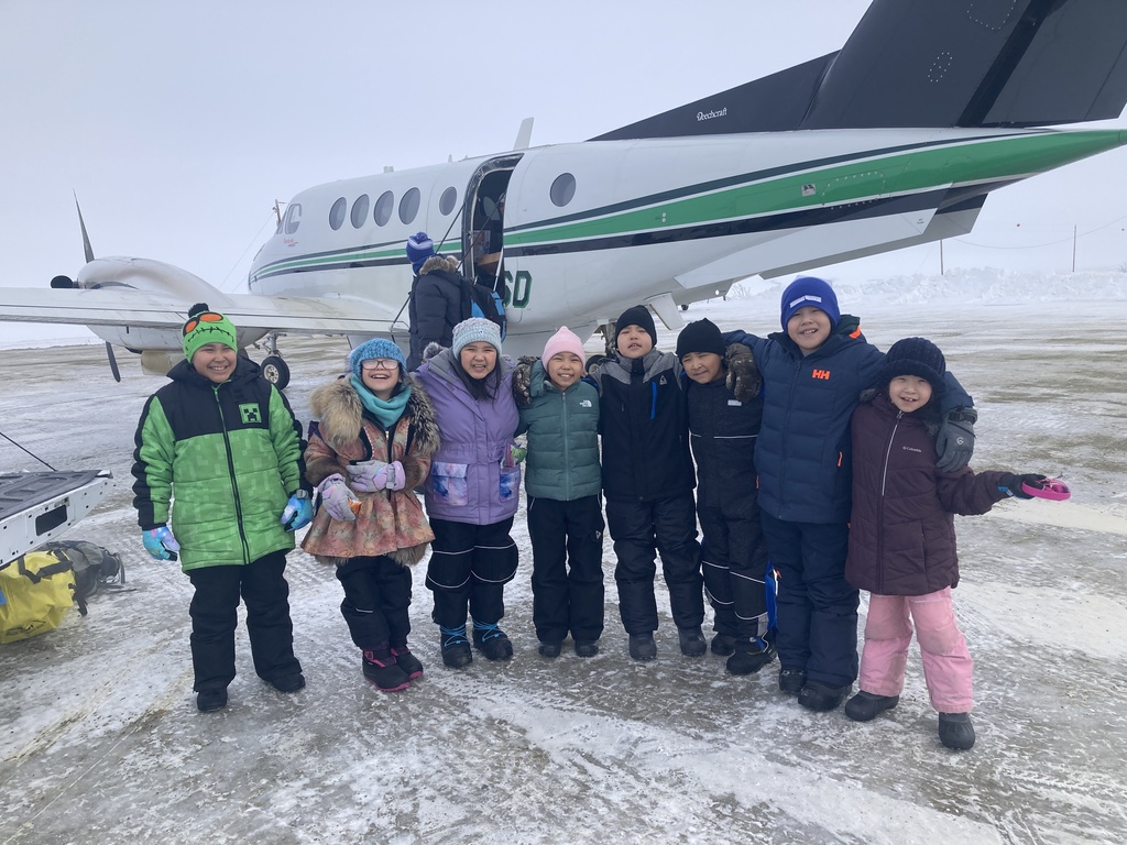 2026 Little Dribblers Team picture in front of the BSSD plane