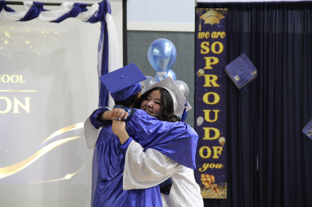 Ben Ongtowasruk and Taylor Bloomstrand Hugging after the ceremony