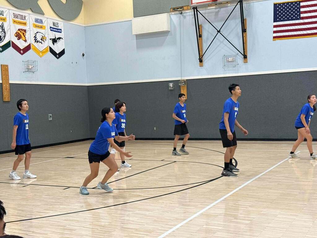 Players on the balls of their feet Teller Alaska volleyball