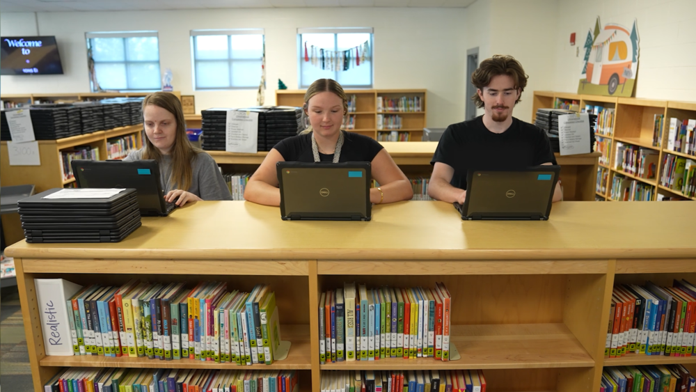 interns working on updating chromebooks