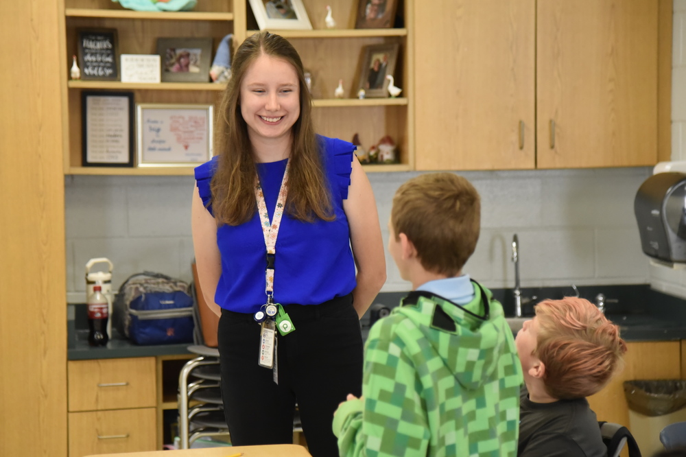 teacher smiling at students
