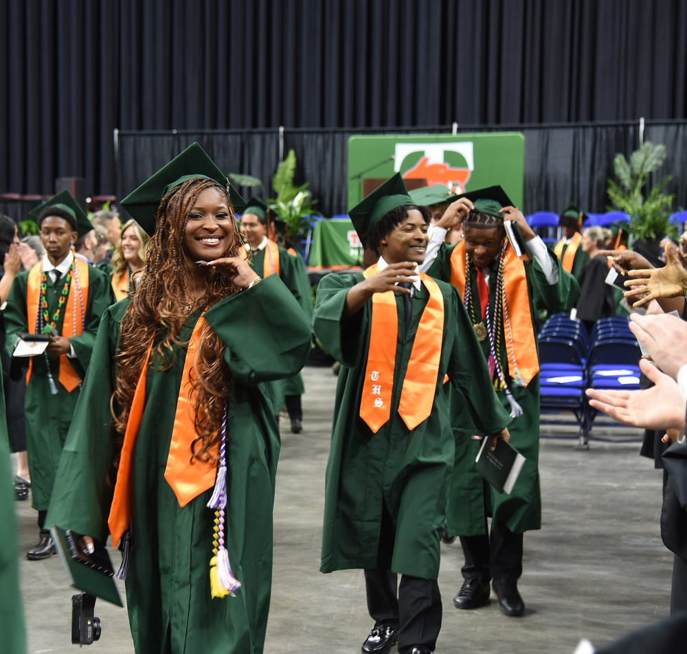 graduates walking out