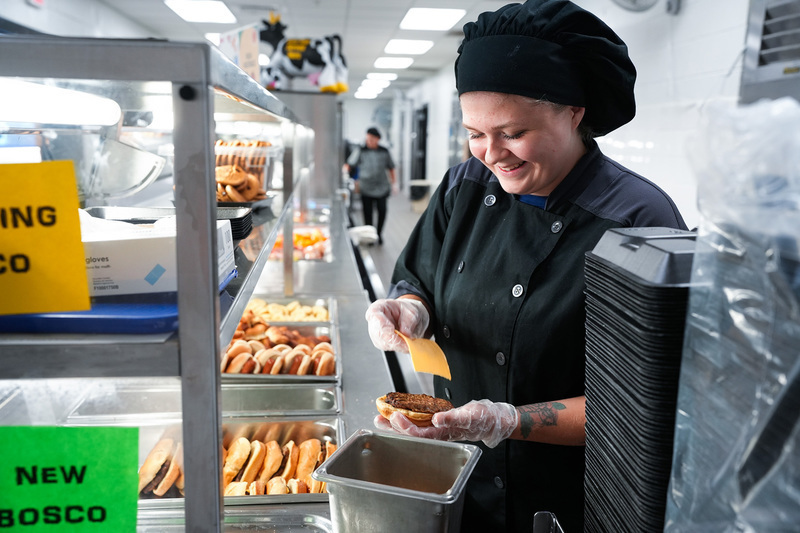 CNS employee preparing lunch