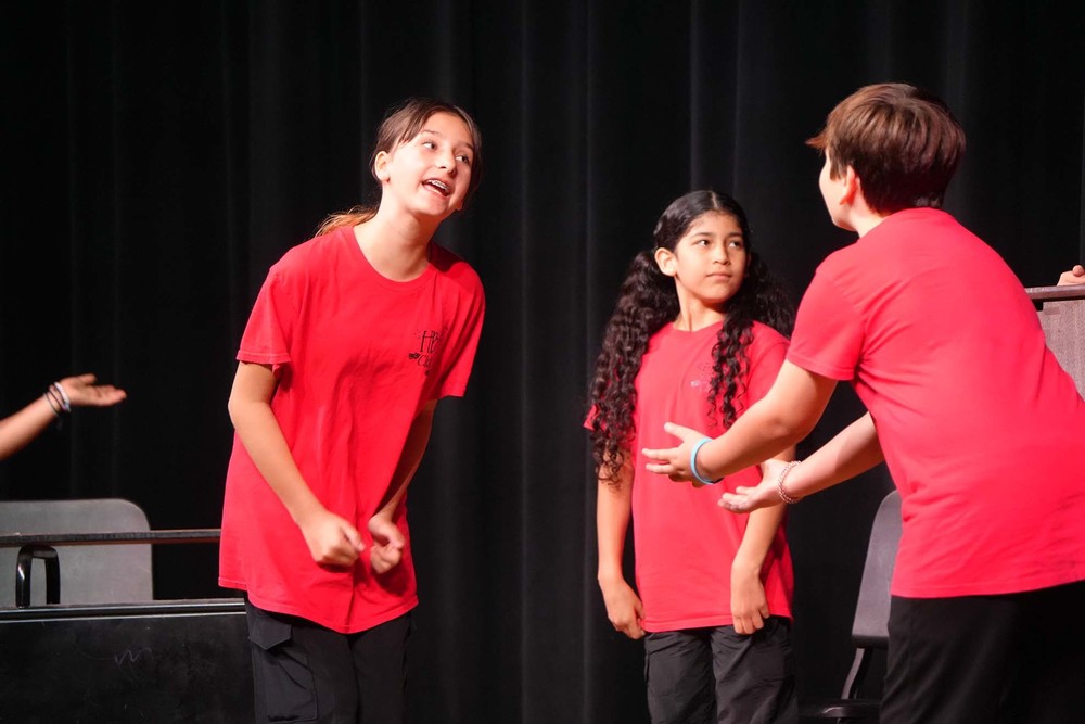 children acting on stage