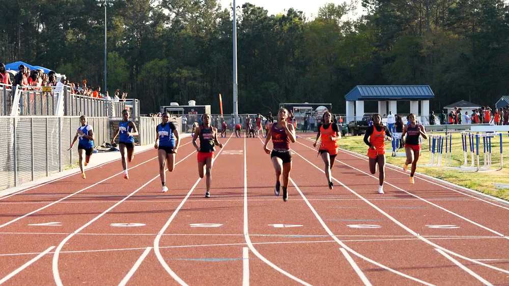 students running on track