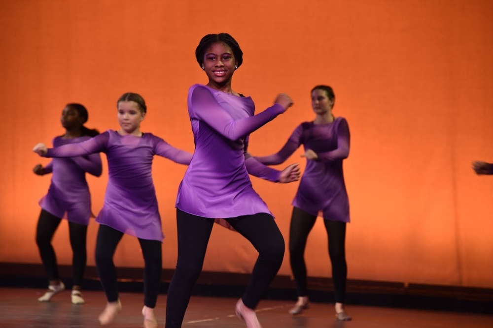 Students dancing on stage