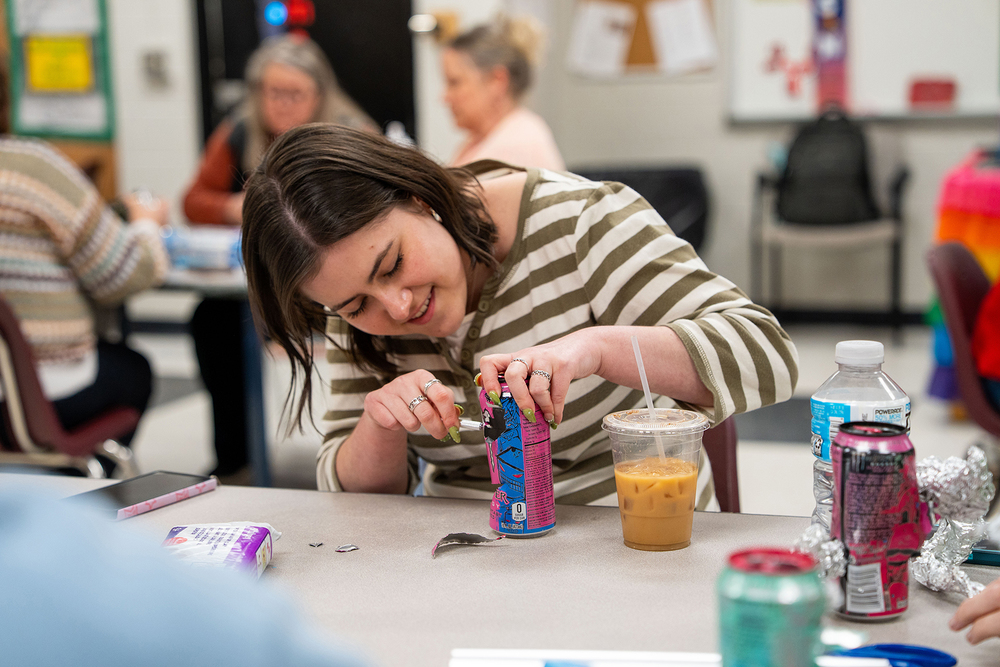teacher working on creation in classroom