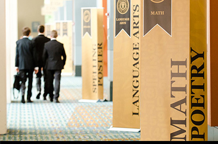 students walking down hallway at beta convention