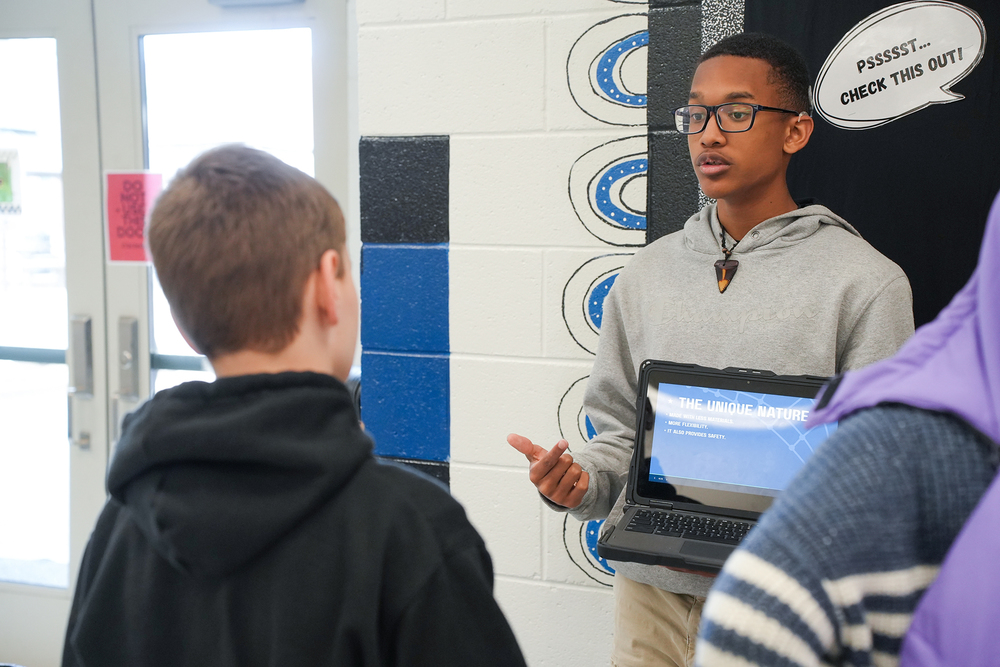 seventh grader presenting to fifth grader