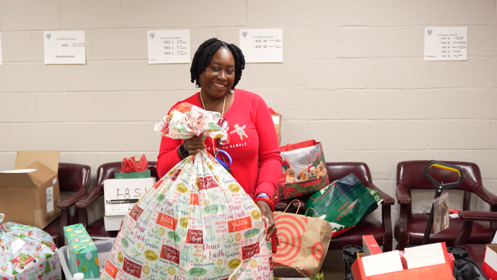 BCSD social worker with a bag o gifts 