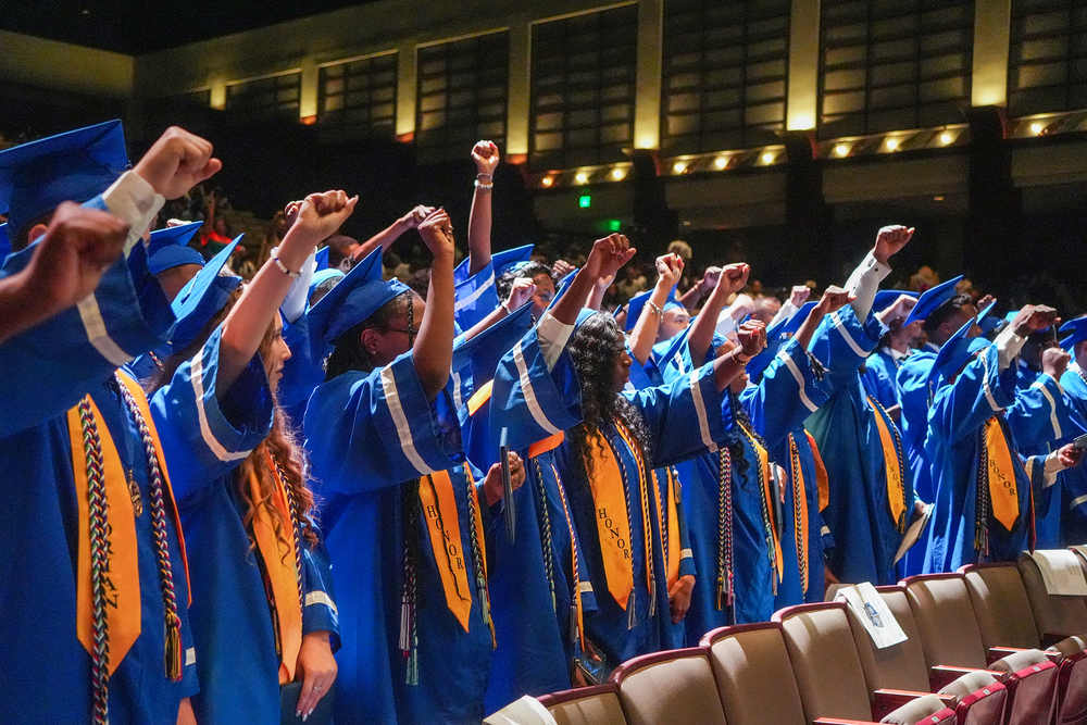 students putting fists in the air