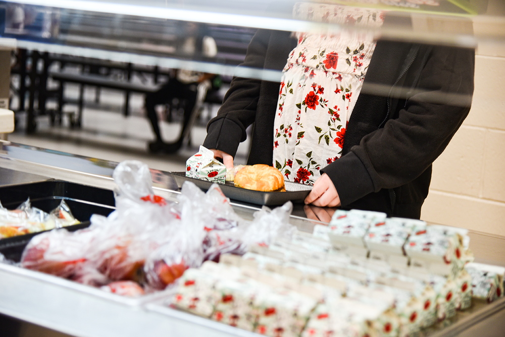 student going through breakfast line