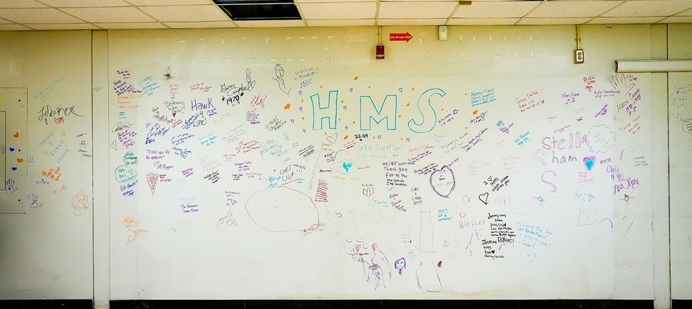 wall of old Hanahan Middle signed by former students