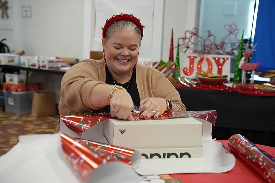 woman wrapping gifts