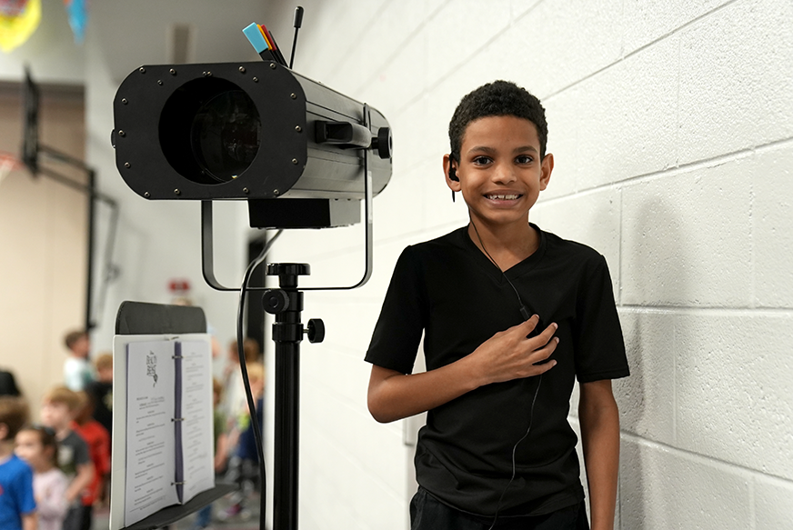 student with studio light