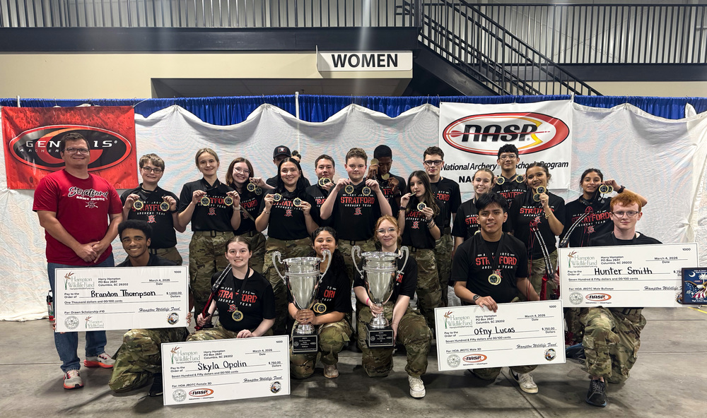 SHS JROTC Archery team with trophies and scholarships