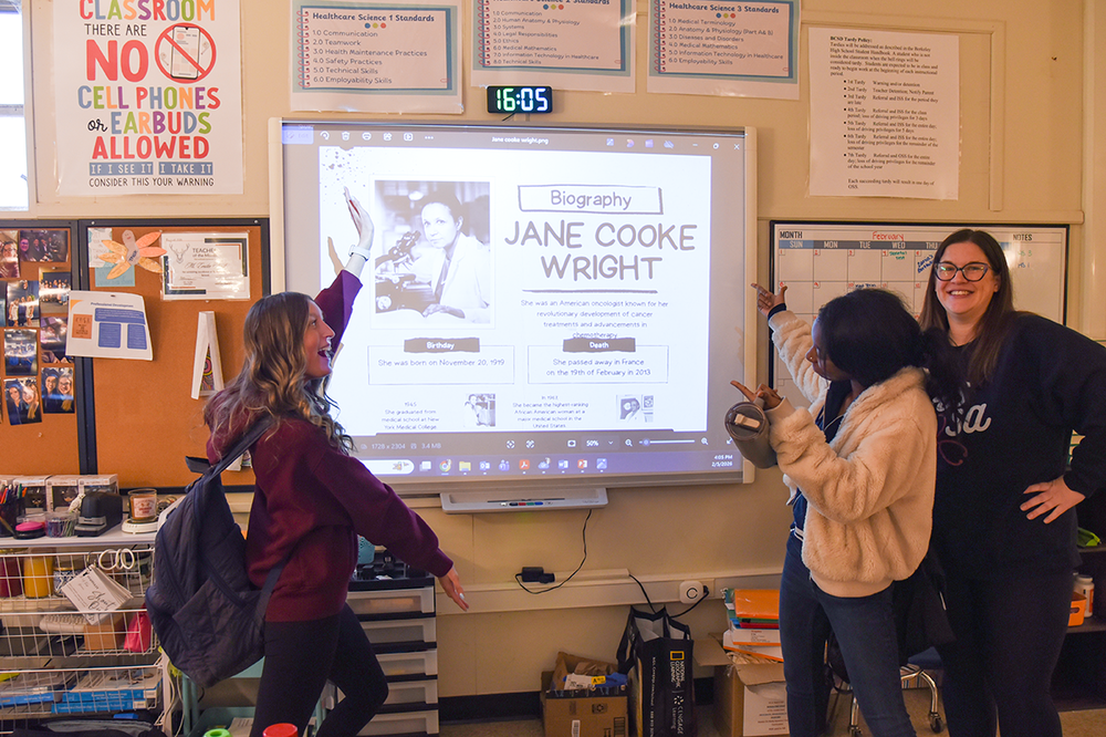 winning students and HOSA teacher  with their presentation aid on Jane Cooke Wright
