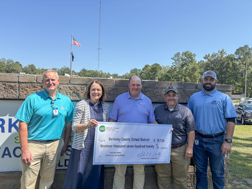 group photo with rebate check