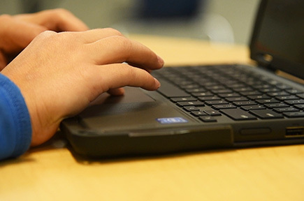 student hands on keyboard
