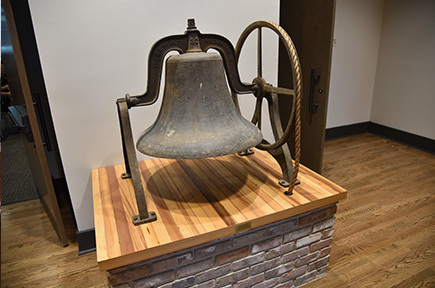 School bell at entrance to Board room