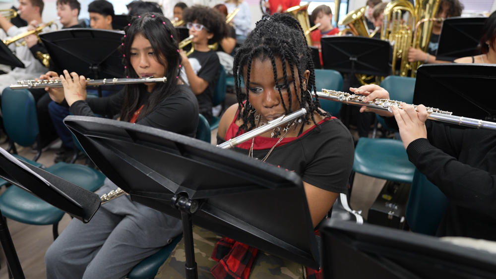 middle schooler playing the flute