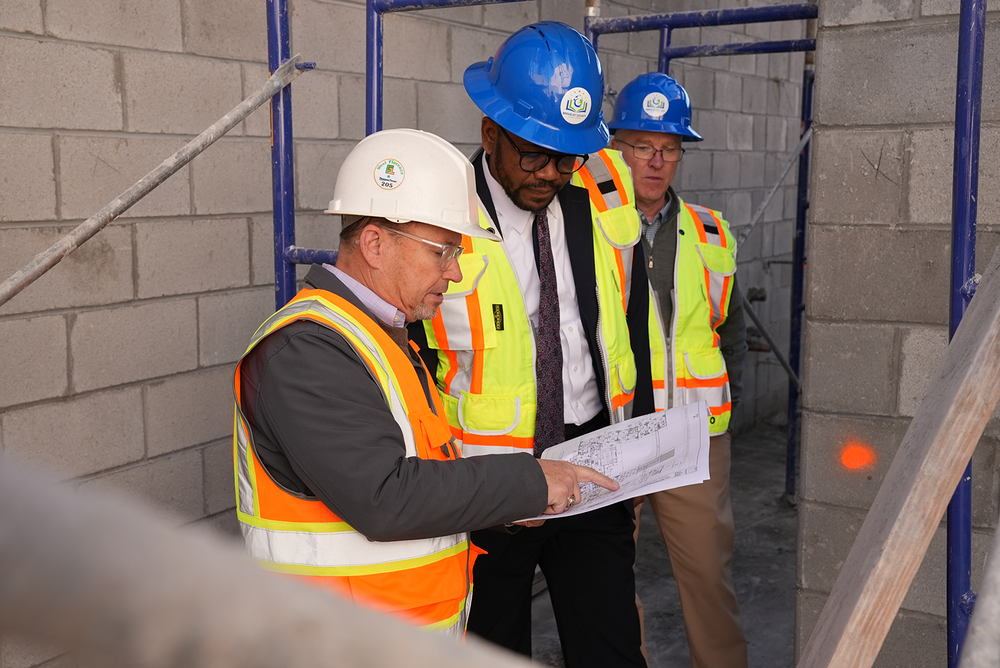 BCSD Superintendent with architect overlooking construction plans 